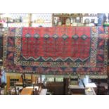 A large good quality Turkish Dosemealti carpet, principally in a blue and red colourway with