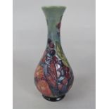 A Moorcroft vase in the Finch and Fruit pattern with impressed marks to base, 17cm tall approx