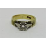 Vintage 18ct diamond solitaire ring with textured shank and raised white gold setting, the stone 0.