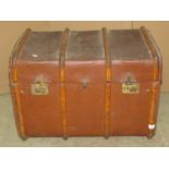 A vintage compressed fibre and timber lathe bound travelling trunk, with domed lid and brass