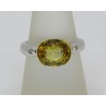 Yellow sapphire and diamond ring, unmarked, tests as 18ct bi-colour gold, size N, 7.8g