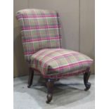 A Victorian drawing room chair raised on cabriole supports, reupholstered in a tartan weave wool