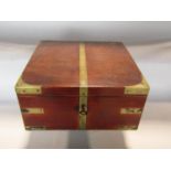 A 19th century mahogany and brass banded box with rising lid and void interior, with brass