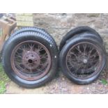 A pair of Model A Ford 1928/29, 21 inch wire spoke car wheel hubs and pneumatic tyres, together with