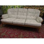 Ercol light elm Jubilee three piece lounge suite with spindle back, three seater sofa and two lounge