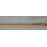 A good quality Hermes of Paris bamboo swagger stick with knobbed end and tan leather hand grip