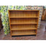1950s golden oak bookcase upon and ebonised plinth base, 123cm high x 121cm wide