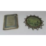 An oval silver photograph or portrait frame, set within a looped border, 10cm max, together with a