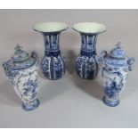 A pair of Royal Bonn two handled vases and covers with blue and white painted Delft type