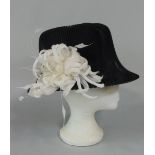 Special occasion designer hat by Philip Treacy (London) with fine black pleated gauze over straw/