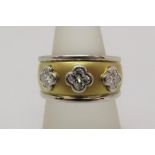 Unmarked byzantine style three stone diamond ring, largest stone 0.25cts approx, tests as 18ct bi-