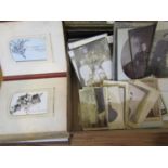 An album containing a quantity of memorial/remembrance cards, a collection of black and white family