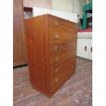 1970s teak secretaire chest, fall front enclosing fitted interior over four long drawers fitted with