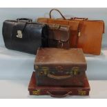 A vintage brown leather travelling case with brass fittings by Brasher & Co of Bristol and five
