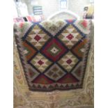 A flat weave Kelim rug with multi medallion panels, 90 x 65 cm approx