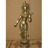 A contemporary cast bronze study of a standing eastern female dancer/goddess, 84cm high