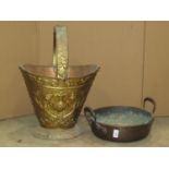 An embossed brass coal bucket and a further 19th century jam pan with loop handle (2)