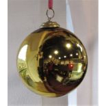 A gold glass witches ball, 14cm diameter