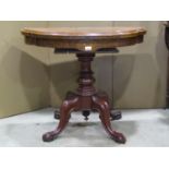 A Victorian walnut and figured walnut shaped D end fold over top card table raised on a turned