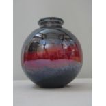 A good quality lustre glass ovoid vase with red and purple mottled streaks, 18cm high