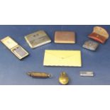 A collection of smoking related ephemera to include a gold plated cigarette case and other examples,