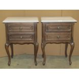 A pair of bedside or lamp tables, each with two frieze drawers, raised on short cabriole supports,