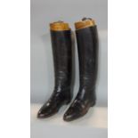 A pair of vintage black leather riding boots complete with trees