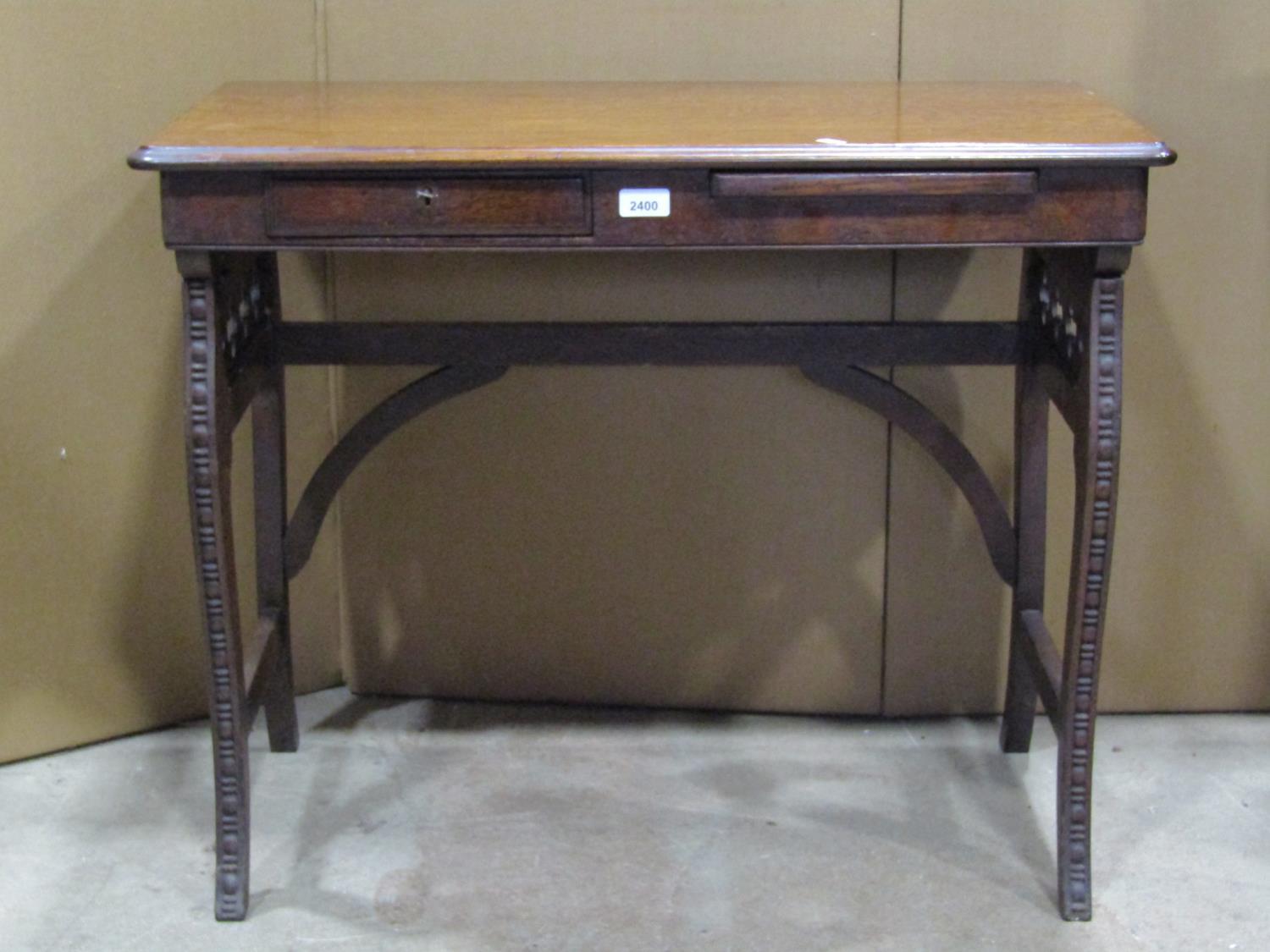 Late 19th century American oak travelling table of rectangular form with folding framework enclosing