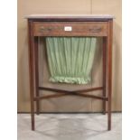 A delicate inlaid Edwardian mahogany sewing table with satinwood crossbanding and boxwood