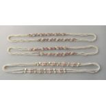 Three cultured pearl sautoir necklaces, strung with both white and pink pearls and gold and gemstone