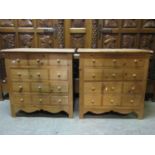 A pair of small stripped pine four drawer bedroom chests disguised as twelve short with turned