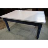 A Victorian pine farmhouse kitchen table, the boarded top with later formica cover raised on