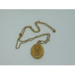 Ornate yellow metal locket set with turquoise, hung on a 9ct belcher link necklace, chain 6.8g