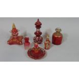 Six 19th century cranberry and pink coloured toilet water and perfume bottles, mainly with