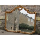 A reproduction gilt framed wall mirror, the composite frame with decorative scroll and column