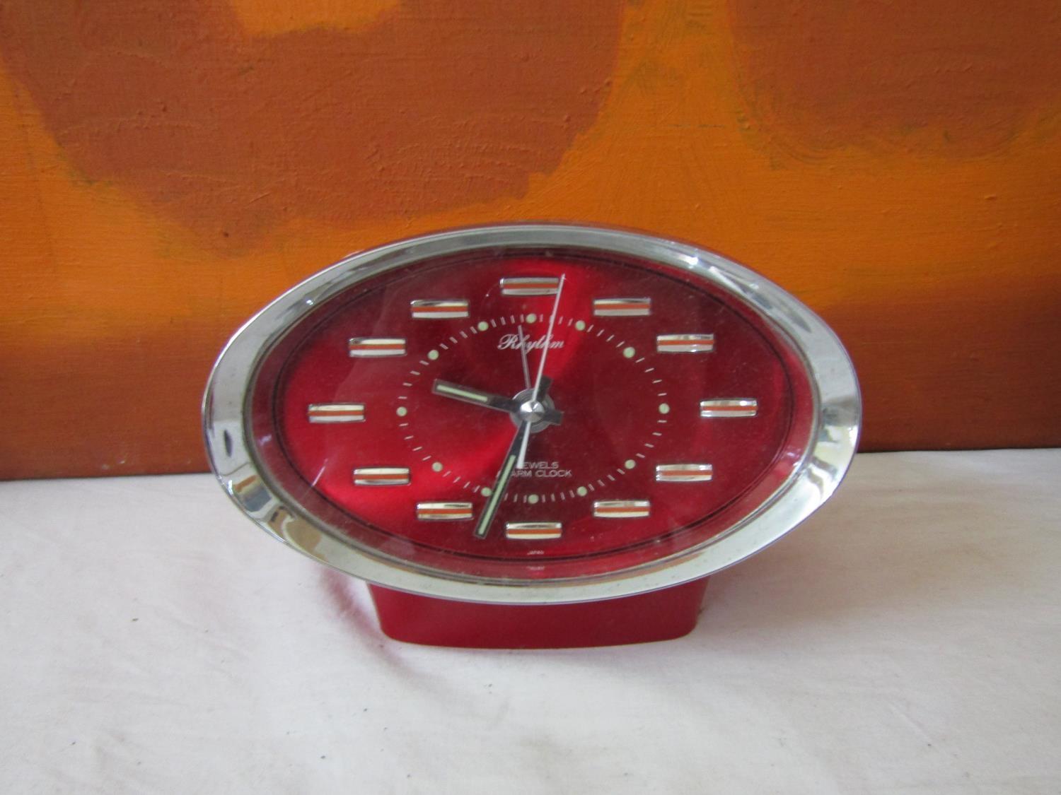 A collection of retro alarm clocks to include a Rhythm four jewel transition bell clock with day - Image 2 of 5