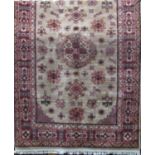 Full pile Caucasian rug with various floral sprays upon a beige ground, 200 x 130cm