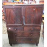 A small Victorian mahogany linen press, the lower section enclosed by two long and two short