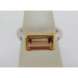 Peach coloured tourmaline and diamond ring, unmarked tests at 18ct bi-colour gold, size N, 7.7g