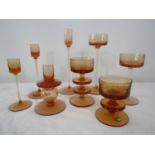 A collection of Wedgwood Kings Lynn candle holders in peach, the tallest 21cm high (8)