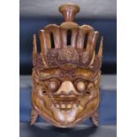 A Chinese hardwood mask with pronounced eyes and other features, with overall carved detail, 66cm