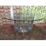 Merrow Associates chrome and glass circular dining or centre table, with thick glass top upon an