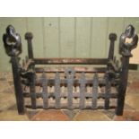 A cast iron fire basket of rectangular form with trellis surround with unusual whale/possibly