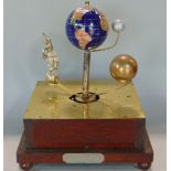 Unusual Orrery with gem set globe and balls upon a brass base, upon a further oak plinth, 30cm high