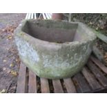 A large and deep weathered natural stone D shaped garden trough with canted corner, approx 95 cm