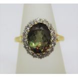 18ct andalusite and diamond cluster ring, maker T T, size O, 7.9g