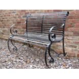 A sprung steel two seat garden bench with strap work seat and combined back, 108 cm wide