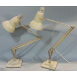 A pair of Herbert Terry anglepoise lamps with original cream painted finish and square stepped bases