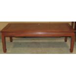 A Chinese hardwood occasional table of rectangular form with moulded outline and supports, 122 cm