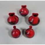 Three Royal Doulton Veined Flambe vases number 1605, 11 cm tall approx, together with a further pair
